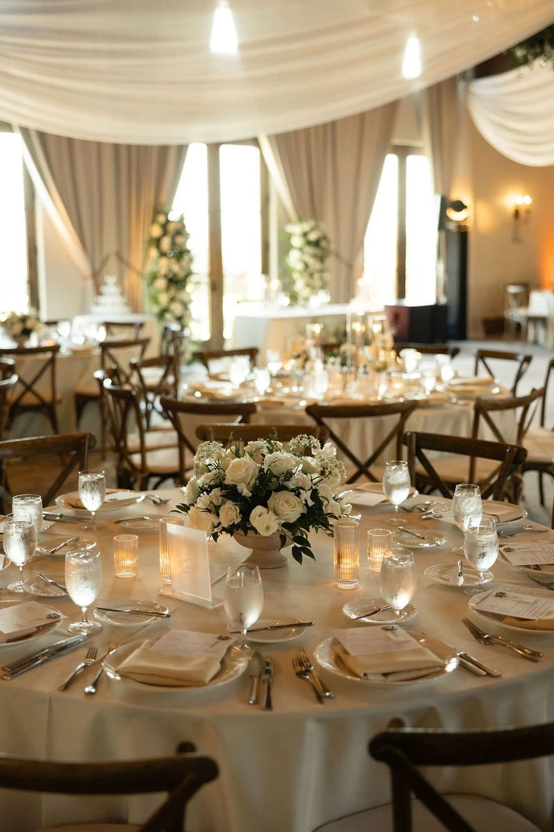Haley Simon Events reception room with a draped ceiling and white centerpieces