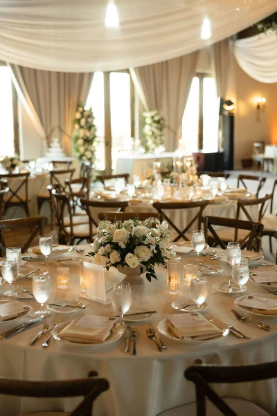 Haley Simon Events reception room with a draped ceiling and white centerpieces