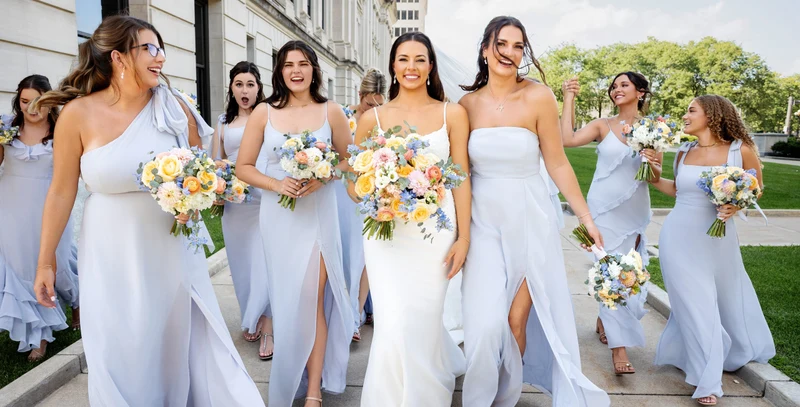 Rose's Bouquets bright mixed bouquets carried by a bridal party in pale blue