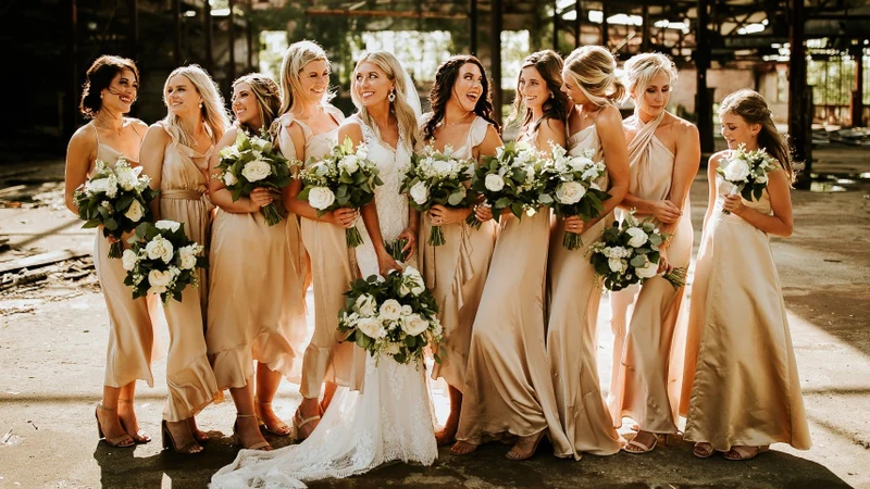 Rose's Bouquets white and green bouquets carried by a bridal party in champagne dresses