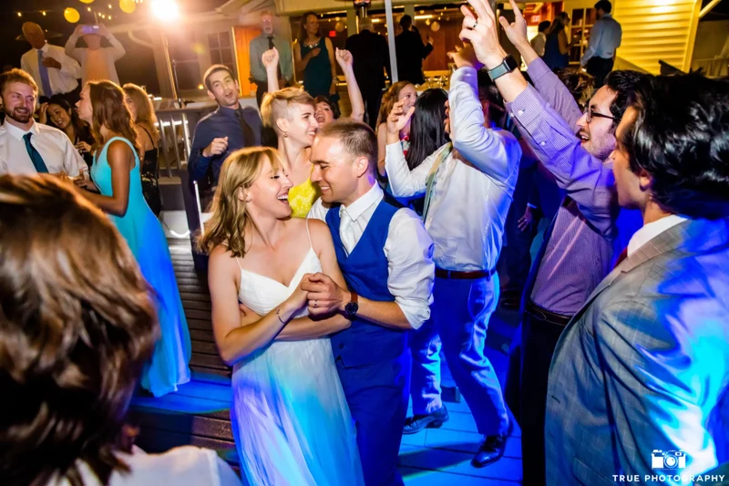Sound Prodigy couple and guests dancing on a packed dance floor at night