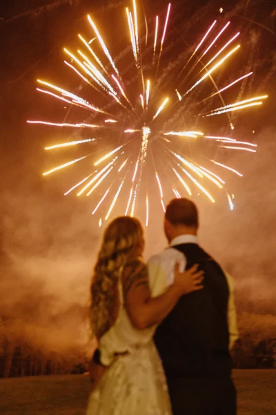 Crown Coordination couple watching fireworks at night