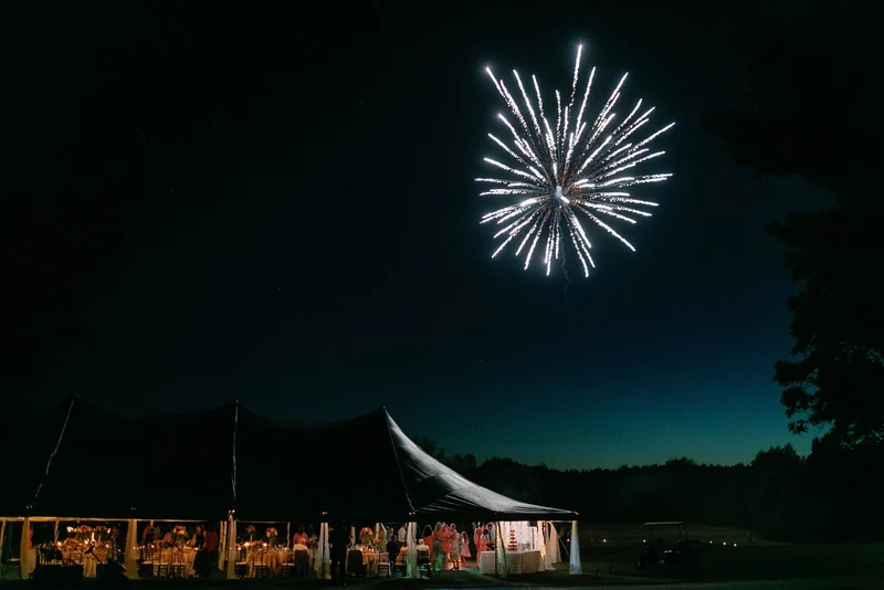 Anna Beth Smith fireworks over a tented wedding reception at night