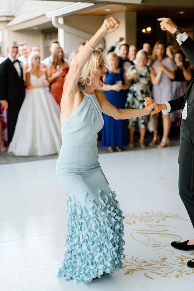 Anna Beth Smith guest dancing with her arm raised at a wedding reception
