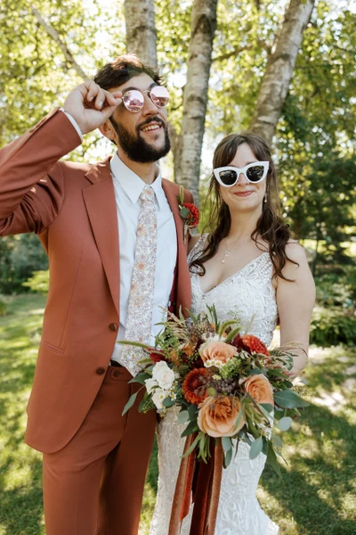 Michael Murphy IV Photography couple in sunglasses with a fall bouquet under birch trees