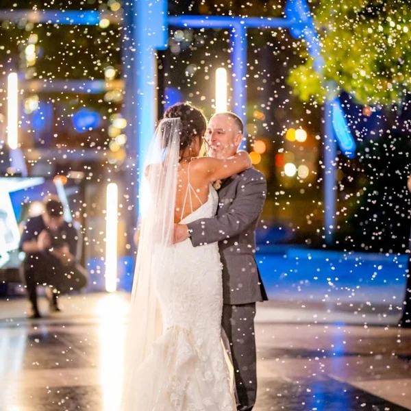 DJ Mike Melice snow effect falling around a couple dancing at night