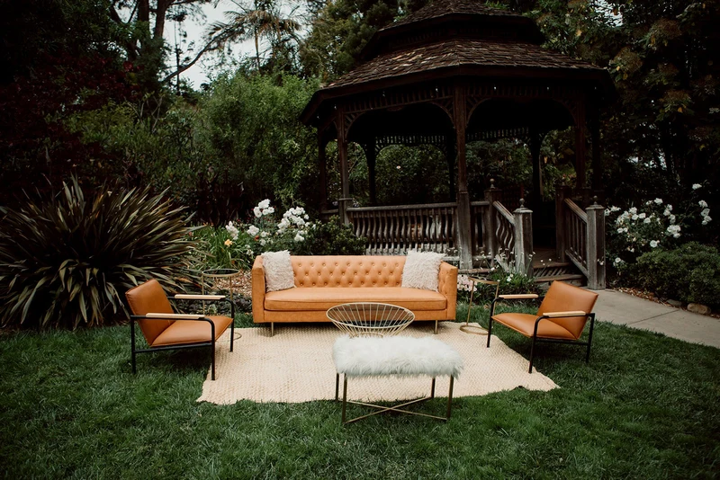 Wonder Event Rentals leather lounge set in garden setting