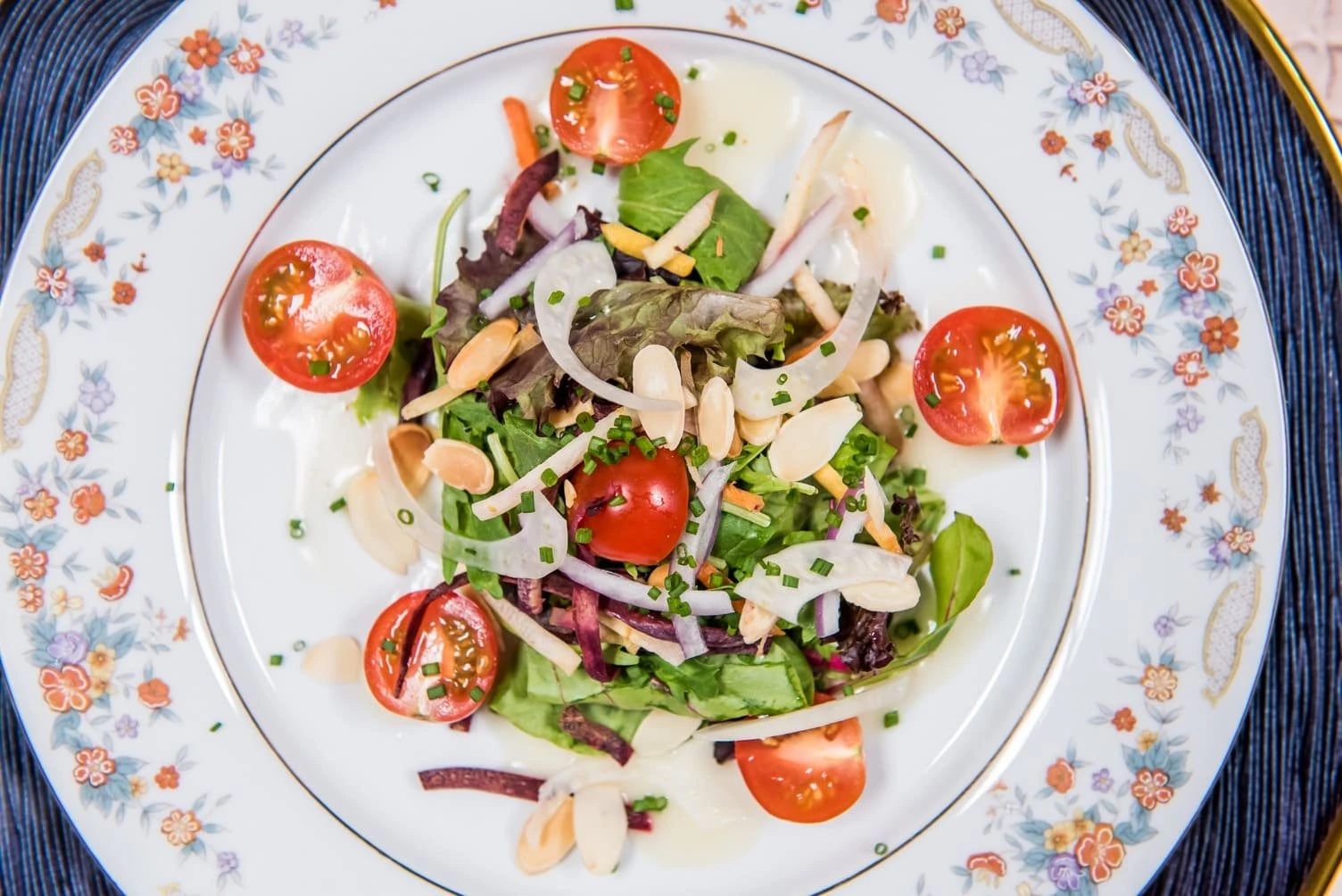 Personal Touch Dining plated market salad with cherry tomatoes and almonds