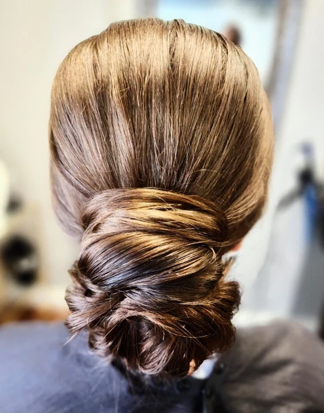 Styles by Lauren low twisted bridal bun seen from behind
